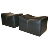 Pair of Saddle Form Rolling Ottomans By Milo Baughman