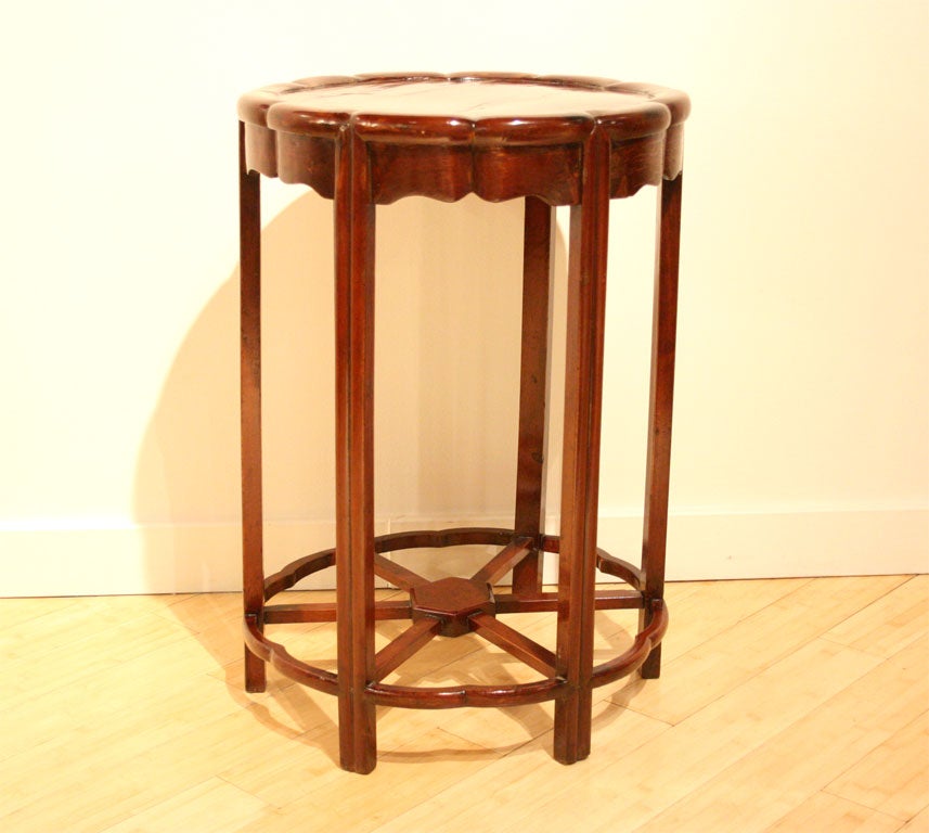 An early 20th century Northern Chinese teak wood side table with scalloped chrysanthemum silhouette, from Shanghai, China.<br />
<br />
Pagoda Red Collection #:  CAE146<br />
<br />
<br />
Keywords:  Table, stand, plant stand, pedestal
