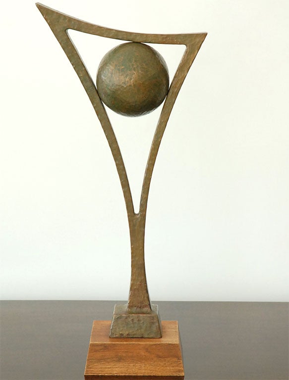 A Patinated Bronze Geometric Sculpture on Walnut Plinth