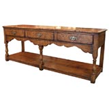 Antique English oak dresser base with three drawers and potboard