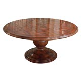 Round English fruitwood table. Parquet top