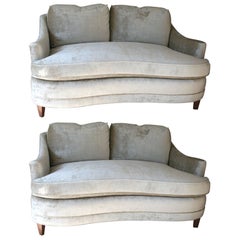Pair of glamorous loveseats in velvet with feather cushions