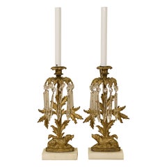 A Pair of Gilt Girondole Lamps with Dogs