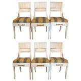 Six 20th c Consulate style dining chairs, fluted backs with pierced gilded frame