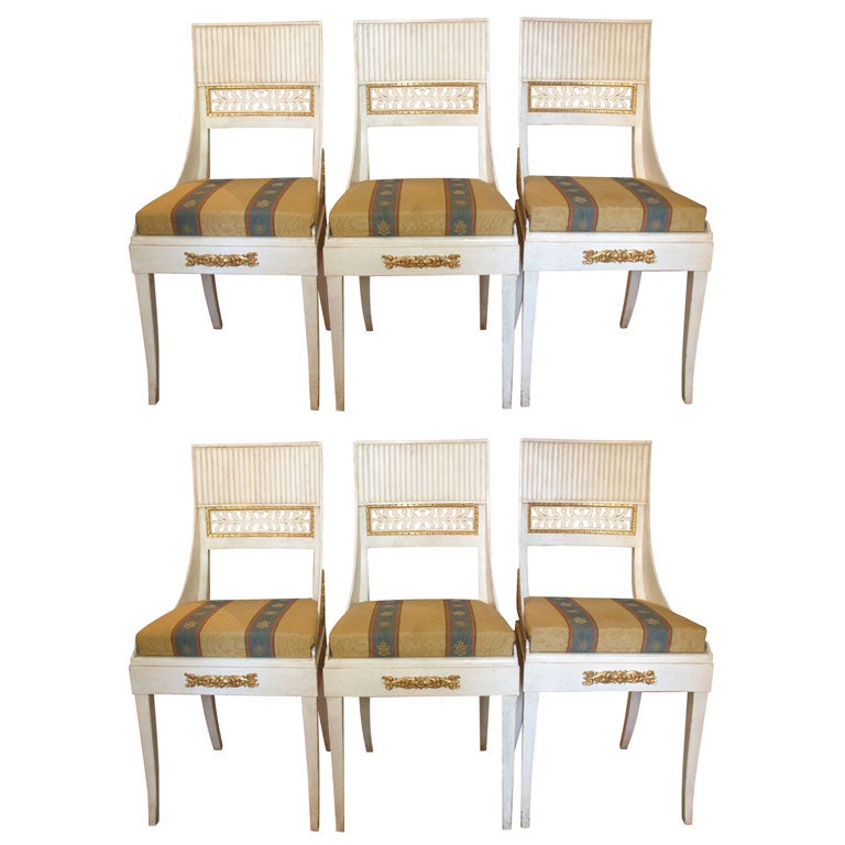 Six 20th c Consulate style dining chairs, fluted backs with pierced gilded frame