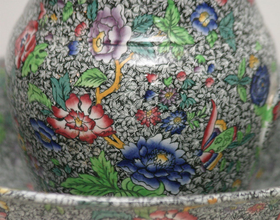 This is a rare set of matching water large water pitcher and bowl with all-over black chintz decoration with polychrome decoration. The dramatic contrast in the Spode 