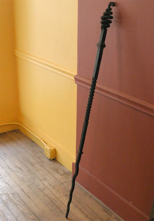 Beautifully hand wrought iron fire poker, with scrolling top, and thunderbolt shaped end.  Large scale, with simple strong details.
