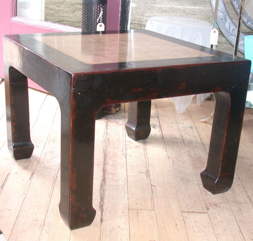 pair of chinese and laquer tables with stone inset top