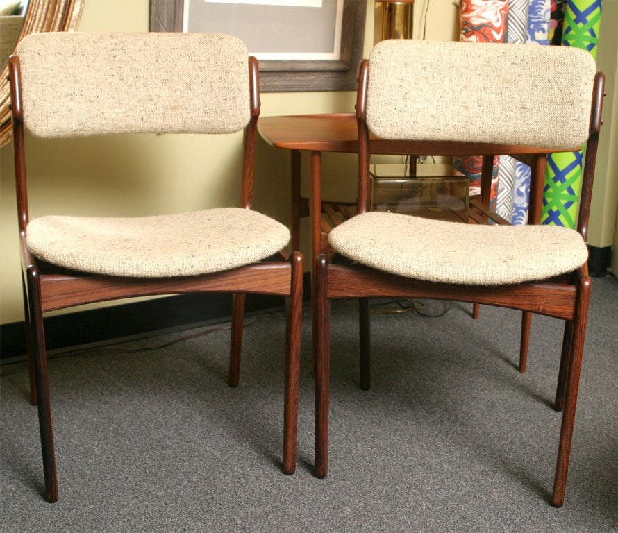 Beautifully sculptured Rosewood Dining Chairs designed by Erik Buck and made by OD Mobler in Denmark with wide shaped floating seats and comfy backrests.  Intriguing curves.  Classic Danish Modern design and sensibility.  Original period natural