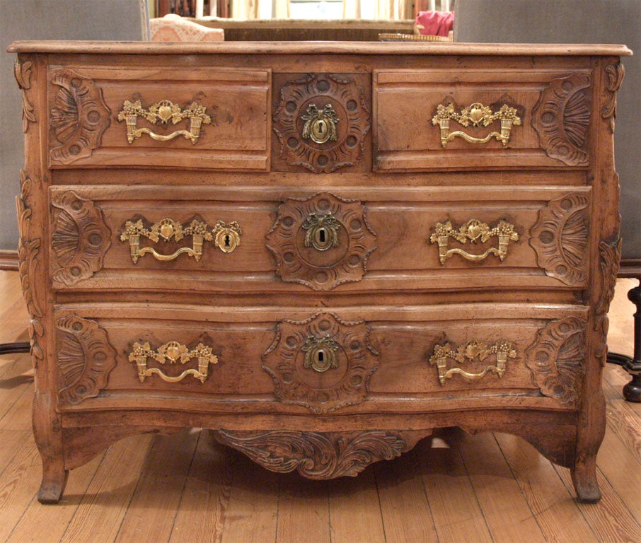 Wonderful walnut Lyonnaise commode with typical Lyon details and great faded patina. unusual second lock on second drawer.
