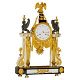 A Louis XVI Marble, Ormolu and Patinated Bronze Mantle Clock