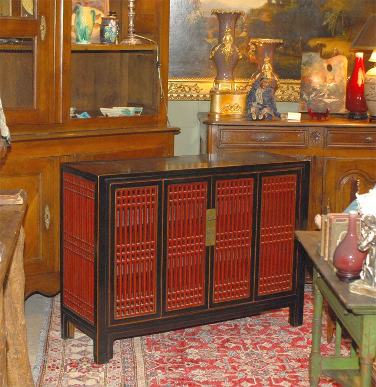 A Chinese Art Deco Red and Black Lacquered Wood Console