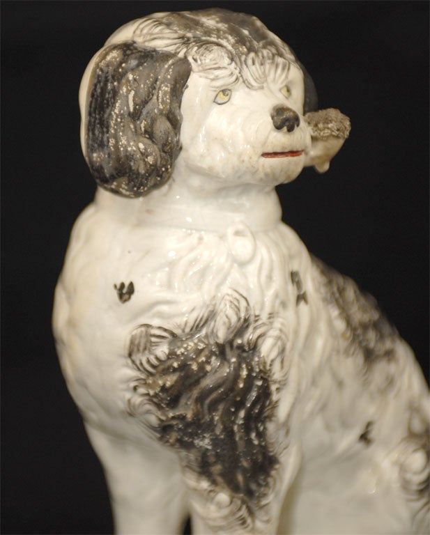 Pottery Staffordshire Pipe Smoking Dog on Base, black and white