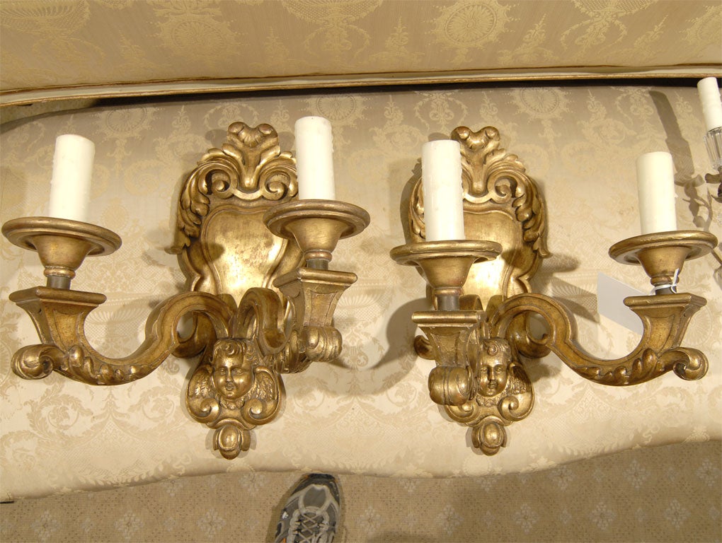 Pair of 20th Century French Giltwood Two-Arm Sconces with Cherub Faces