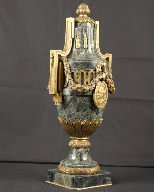 A large French cassolette in green Marble with Gilt-bronze mounts in the Neo-classical taste. 

The marble body mounted with handles in an elongated greek key design, drapery of laurel leaves that surround the central section, an acanthus bud
