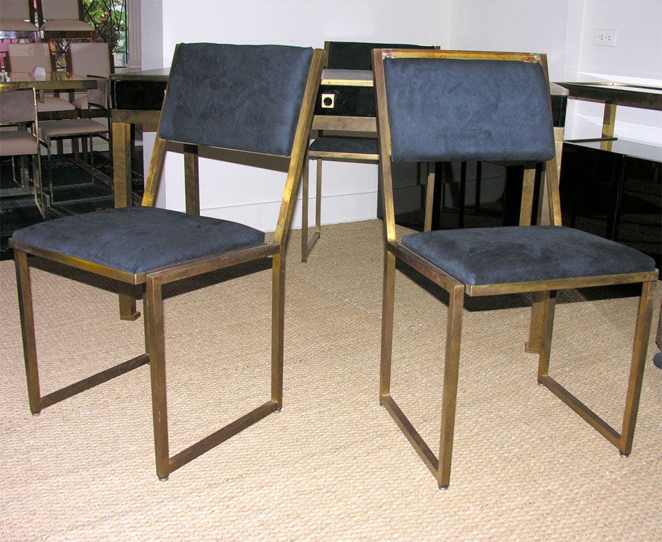 A rare and complete suite of furniture by GUY LEFEVRE, French circa 1960, consisting of a bureau plat, an armchair, two side chairs, two lacquered cubes, a sideboard and a rolling file cabinet. The pieces are in lacquered wood, leather, smoked glass
