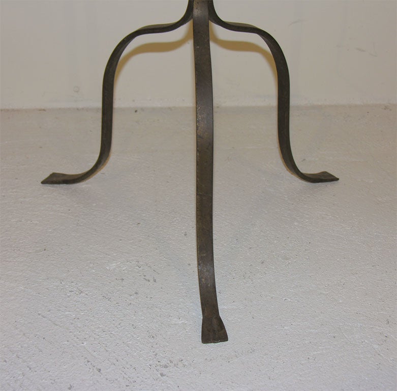 Decorative, vintage wrought iron floor lamp on tripod base. Adjustable lighting<br />
element.  New shade, rewired.  Two lamps available, not identical.