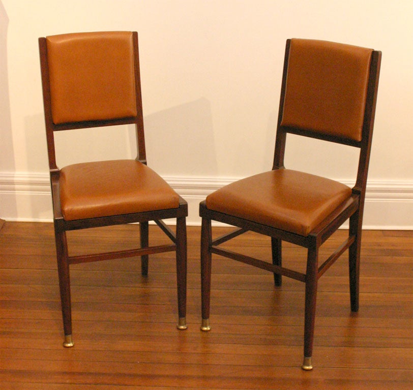Pair of Vienese chairs in rosewood, leather and brass feet in front.<br />
The leather upholstery is new.