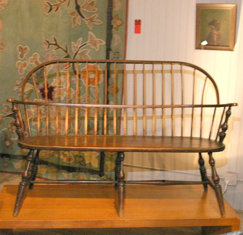 beautifully worn windsor bench<br />
delicately turned form<br />
comfortable