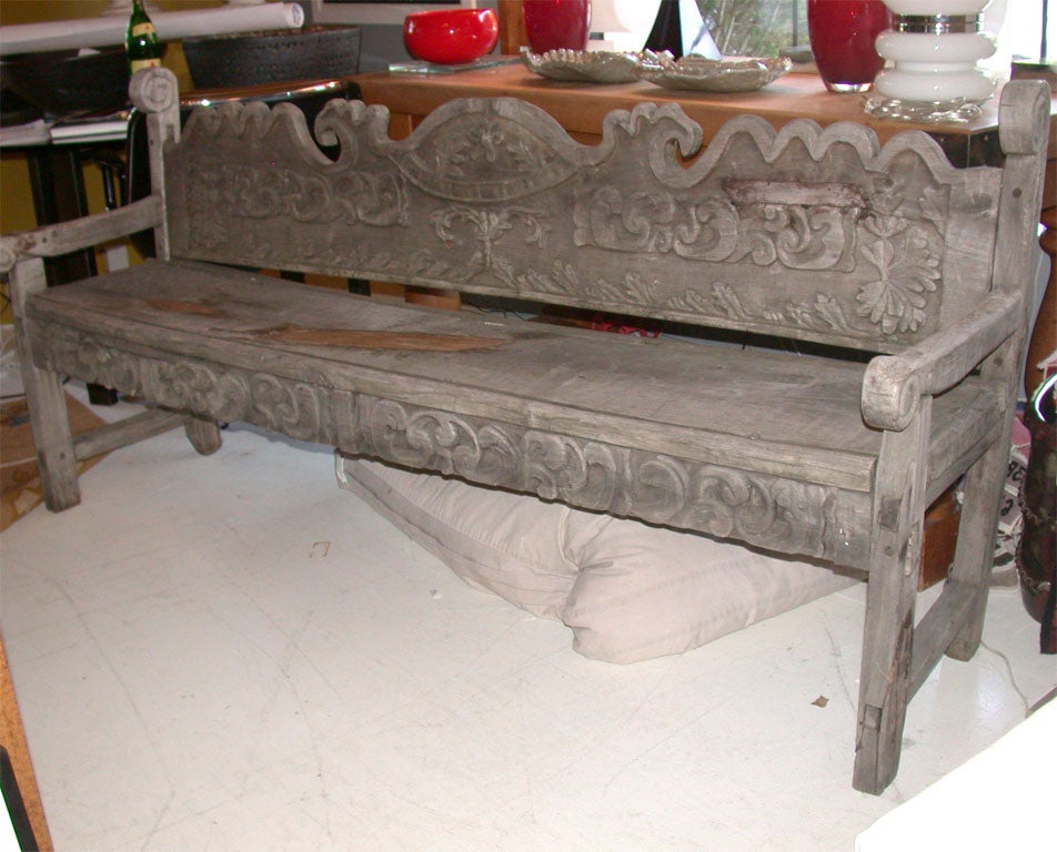 Antique Hand Carved Early American Bench.  The Apron shows  Fleur De Lis Pattern .  The Back Shows Leaves Flowers and Waves.  All in the Primitive Style.