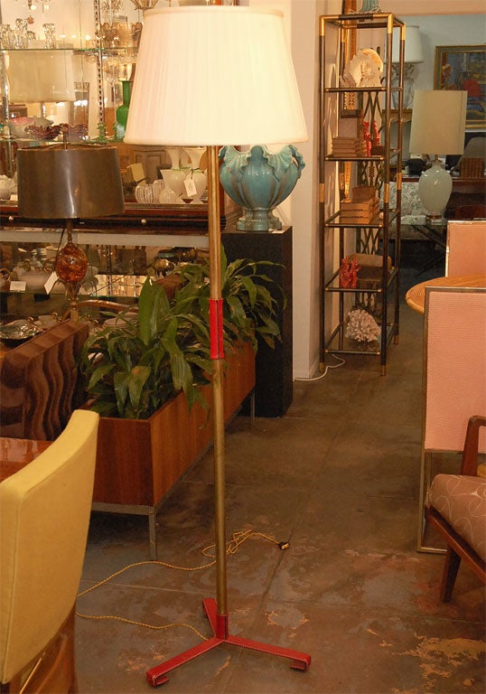 Leather covered floor lamp by Jacques Adnet