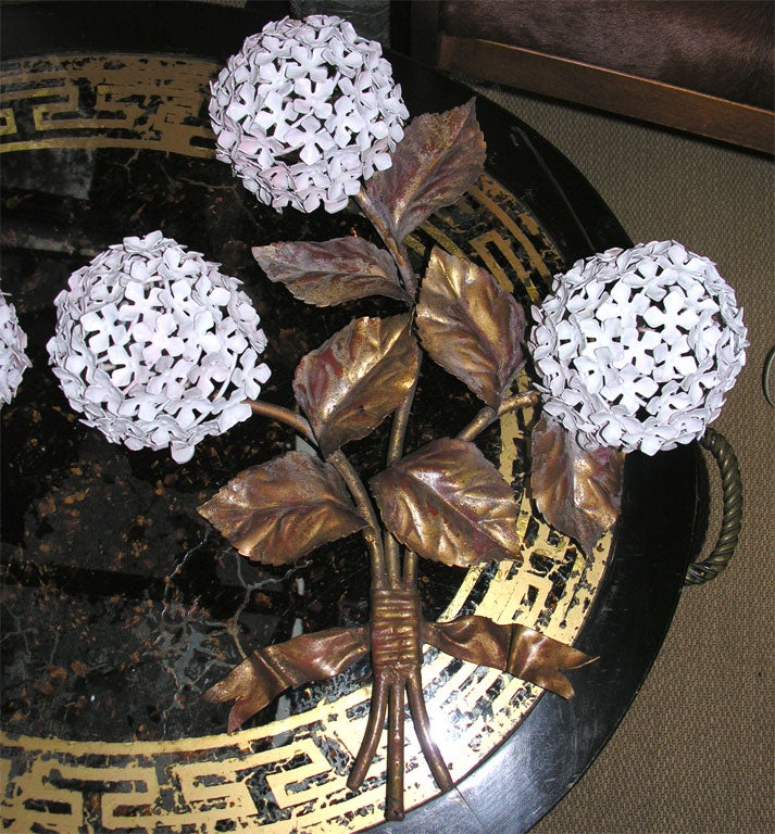 Unique marvelous large sconces, painted metal with gilt stems. Light located behind each white hydrangea.