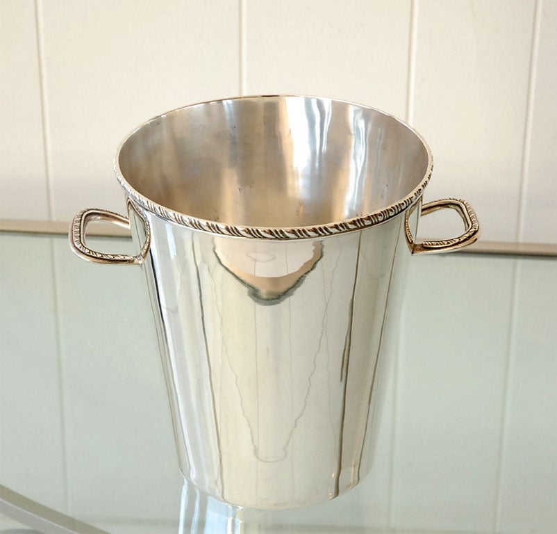 A sterling silver champagne/ice bucket by the well known and collected Juventino Lopez Reyes (JLR). Don Juventino's work is well recognized among Mexican silver collectors and was written up by Penny Morrill in Silver Magazine. The bucket has