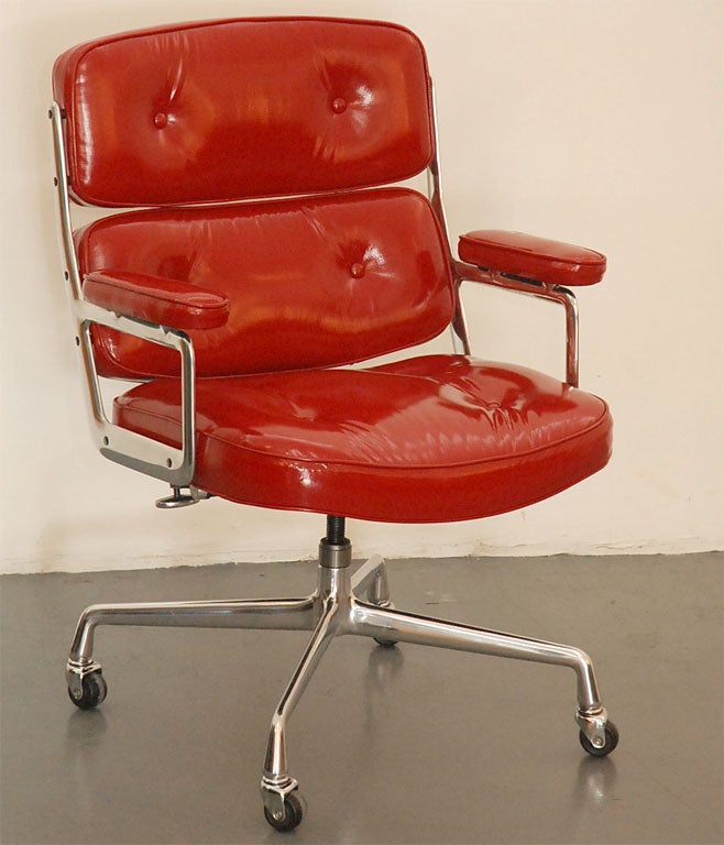 Classic office chair, from the Time Life building in New York. Designed by Eames. Newly upholstered in red patent leather with perfectly polished aluminum base. Multiple quantity available and may be reupholstered in any leather.