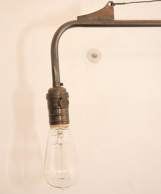 atelier swing arm wall sconce