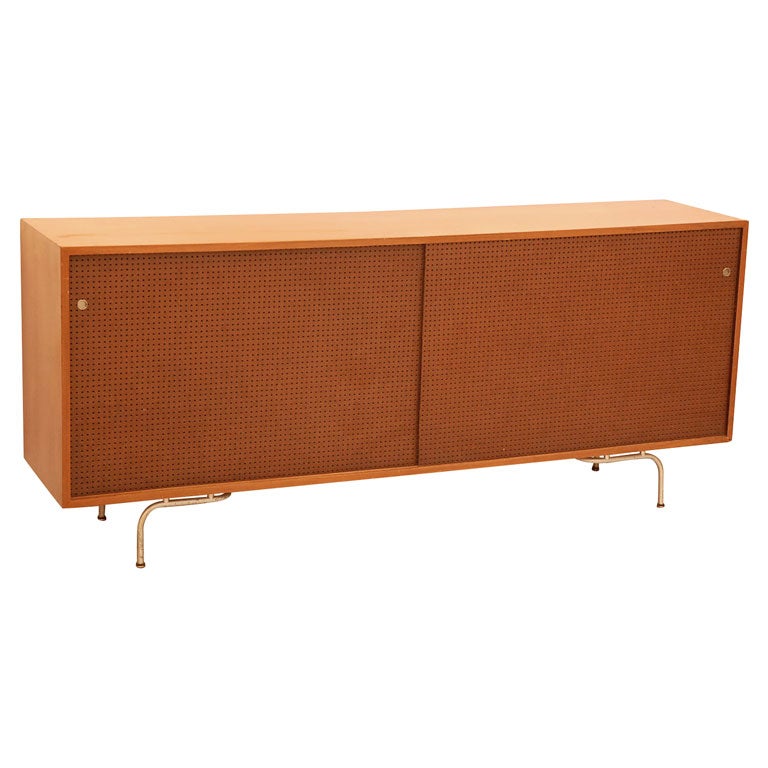 Walnut Credenza with Pegboard Sliding Doors by Maurice Martine
