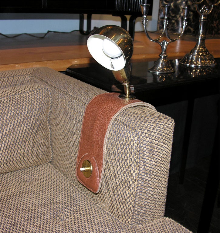 Brass Reading Lamp with Brown Leather Armrest Strap.