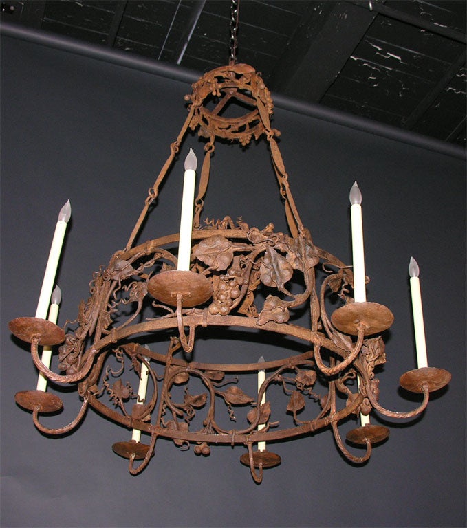 Wrought iron eight-light chandelier with basket & grapes motif