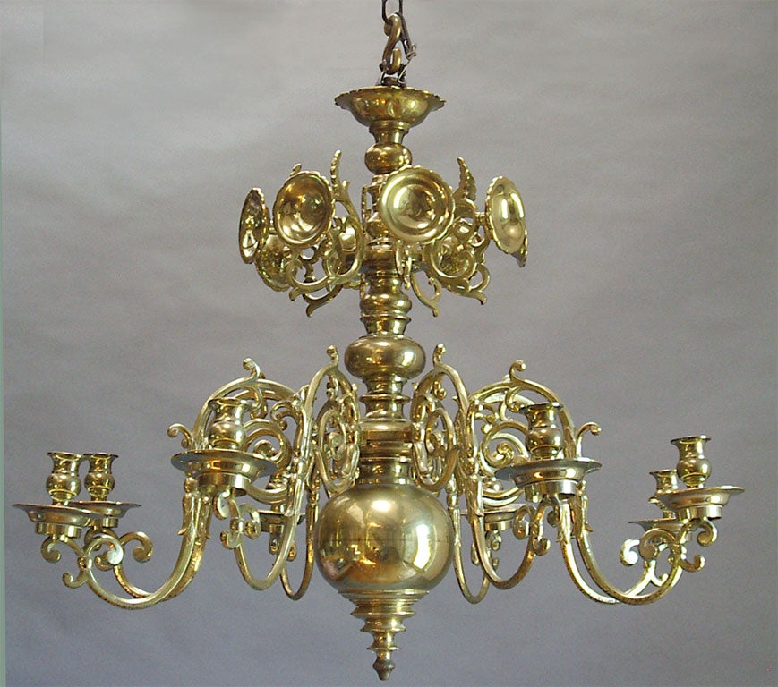 Baroque centennial brass candle chandelier from the Baltic region of Russia.  Eight arms and eight reflectors.