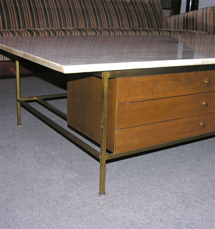 A generous scale cocktail table with a clever marriage of wood, metal and stone with jewelry box style three drawer storage cabinet, model. no. 8705. By Paul McCobb for Calvin Furniture. U.S.A., circa 1950.