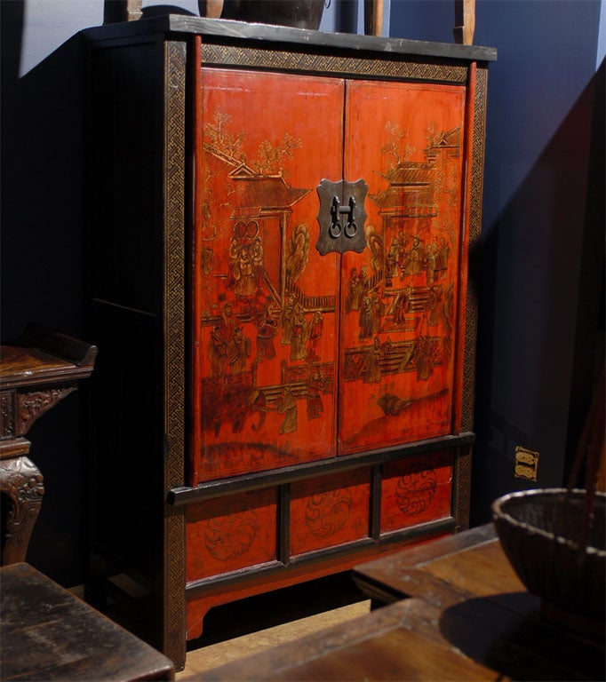 Finely detailed 19th Century Qing Dynasty Shanxi Red, Black, and Gilt Painted Cabinet of Elm with three drawers on the interior and a lifting door to a built in storage chest below.