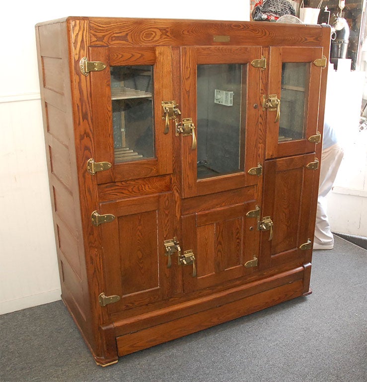 THIS CANADIAN OAK ICE BOX/REFRIGERATOR HAS ALL NEW REFRIGERATION SYSTEM AND NEW WIRING READY FOR USE.GREAT FOR A BAR OR RESTAURANT ALL FINISHED TO PERFECTION.THE HARDWARE IS ALL ORIGINAL BRASSES.EVERY THING ABOUT THIS PIECE IS ORIGINAL.THE WORKS ARE