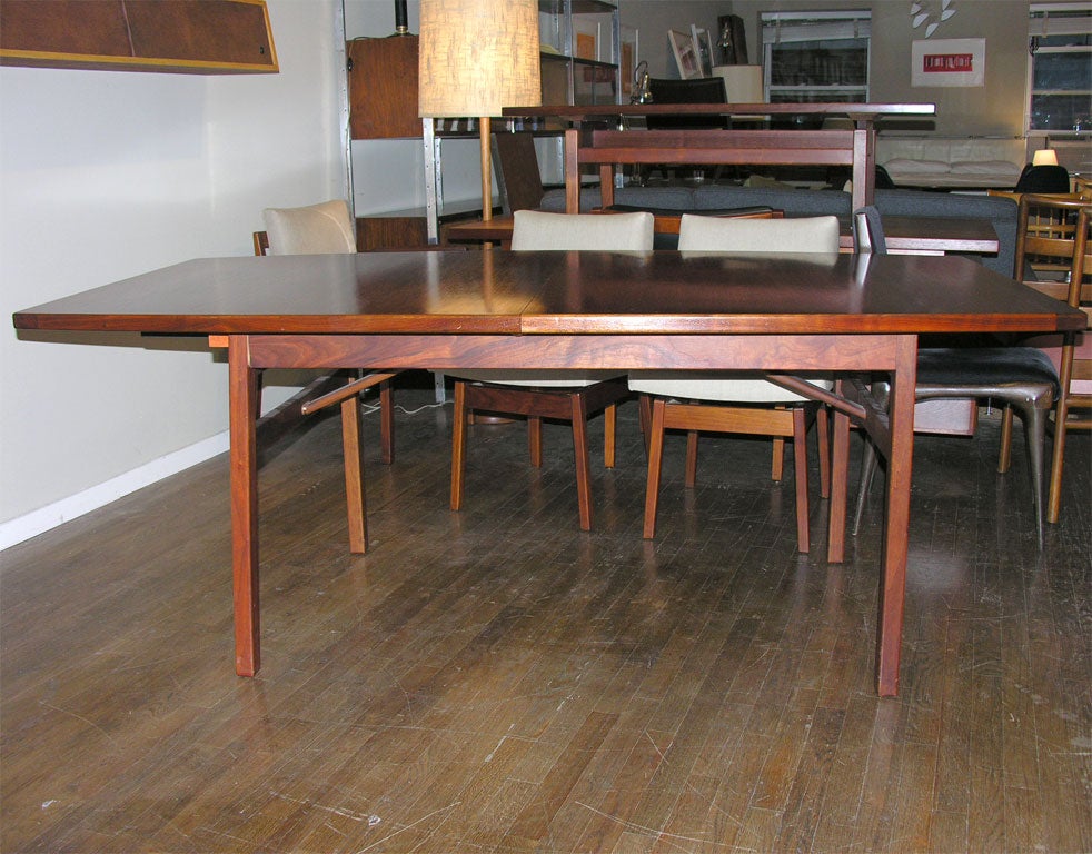 20th Century Jens Risom walnut boat shaped dining table with 6 chairs