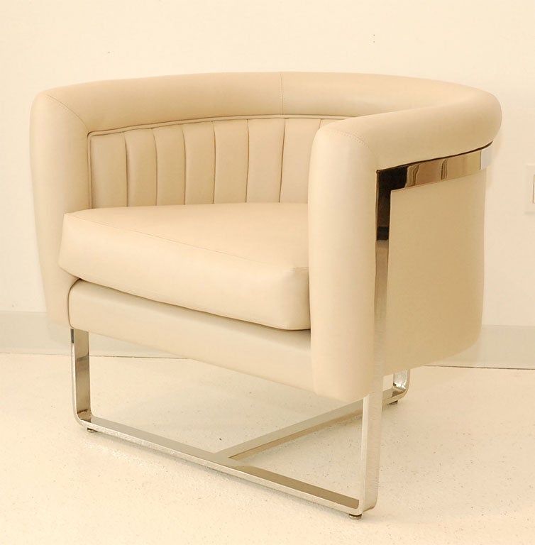 A pair of chrome and leather tub chairs designed by Pace Furniture.  Newly reupholstered in ivory/bone leather.