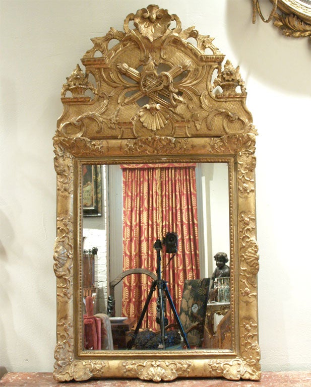 Period Regence Gilt Wood Mirror with original plate and guilding. Wonderful pierced crest.