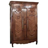 Antique French fruitwood armoire. Chevron patterned.