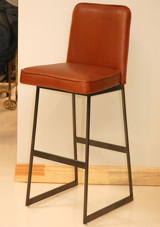 Pair of new  barstools with gun-metal steel bases and new brown oxblood leather with piping.  Can be made to order for $950 COM each.  Fabric requirement is 1 yard per bar stool.  Chrome is also an option.