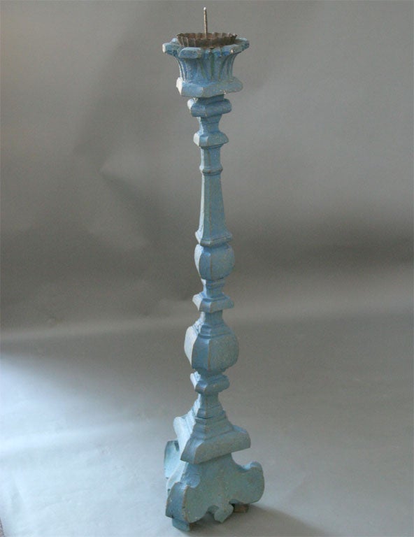 Decorative wooden floor candlestick, Italy circa 1690, in secondary blue paint. Iron candle spike and drip catcher.