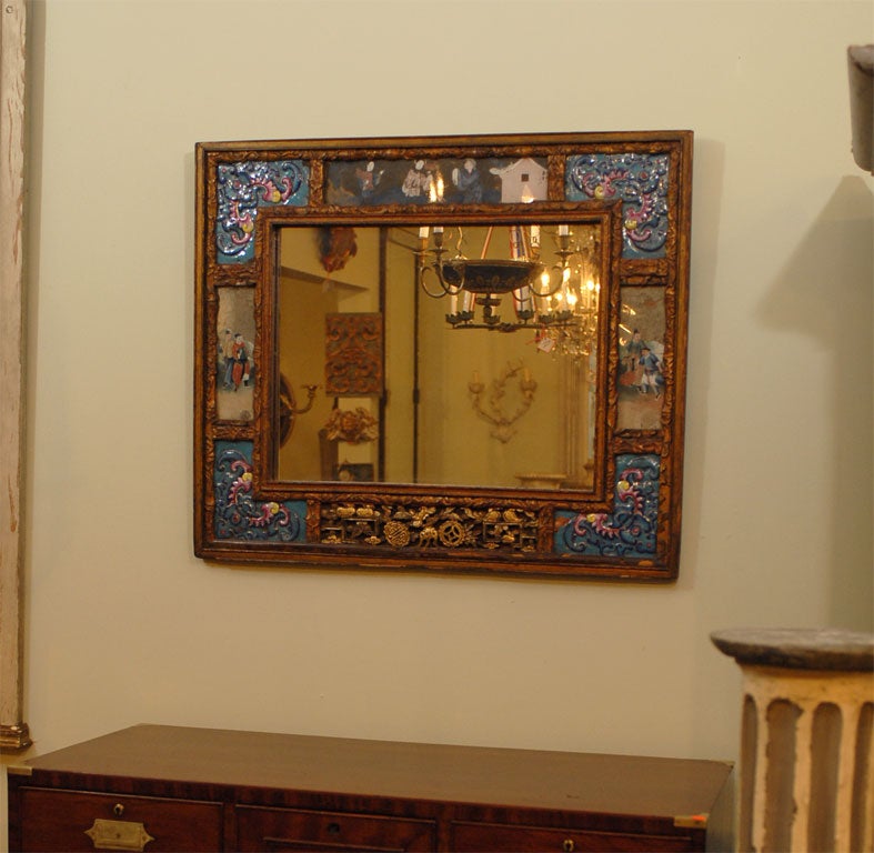 Chinese enamled, carved and gilded mirror with inset reverse paintings on glass