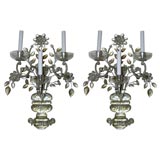 Pair Bagues three light wall sconces.