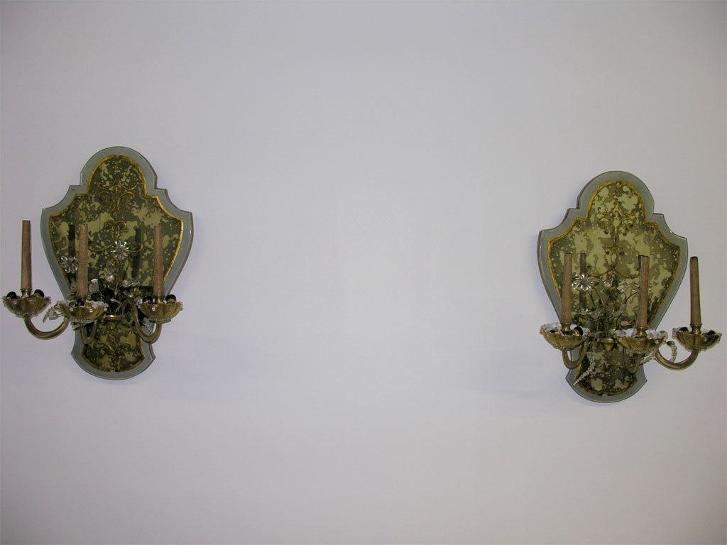 Pair of shield back mirror sconces