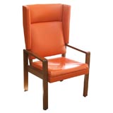 An Orange Swedish Wing Chair