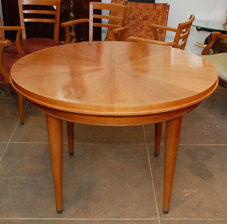 Cherrywood dining table with leaves, in the style of Jules Leleu