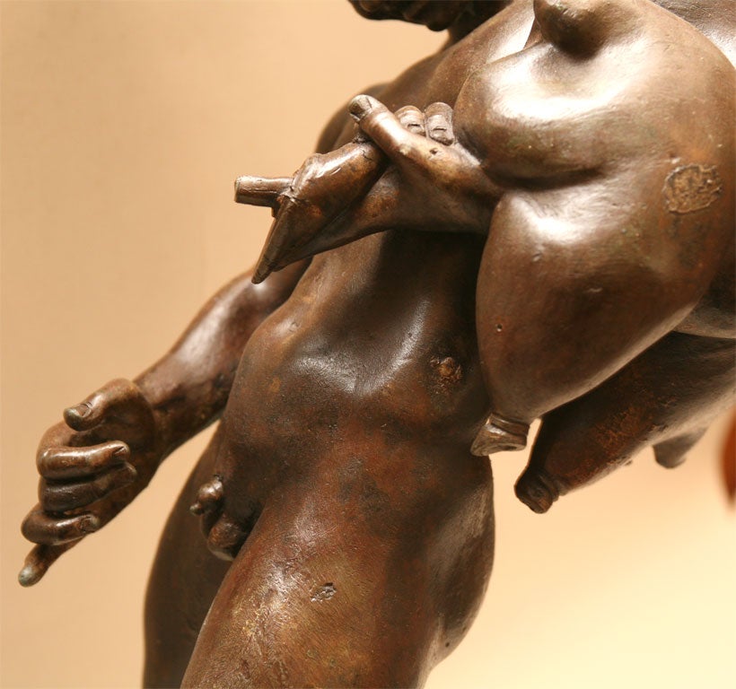 Bronze of young Faun with Wine sack 1