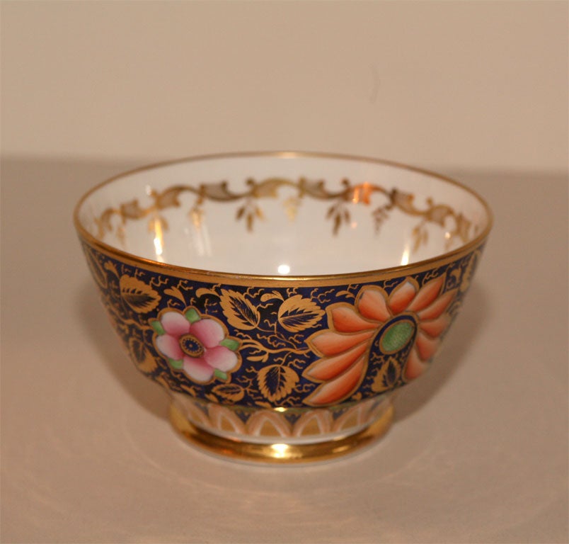 Striking Imari porcelain 5 piece tea set with hand painted all-over floral decoration, gold highlights and includes the rare trivet!