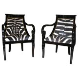 Pair of Zebra Hide and Ebonized Carved Mahogany Armchairs